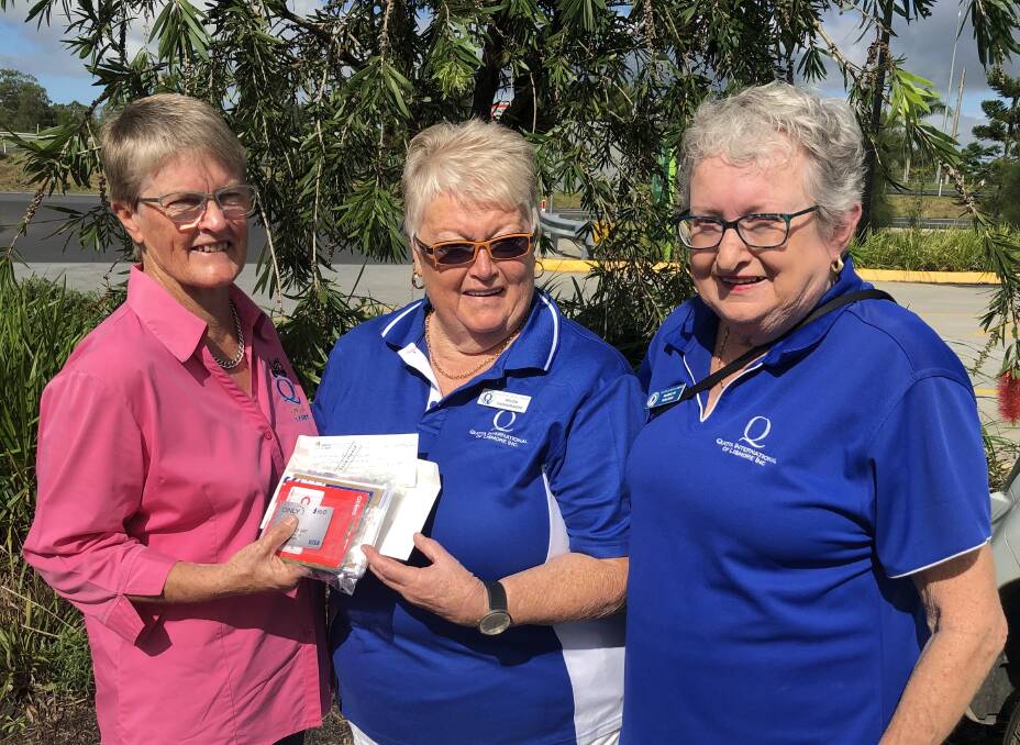 Marj Phillips of Taree Quota (left) presents a cheque and gift cards to Lismore Quota representatives, Marilyn Malden and Helen Casagrande. Photo supplied
