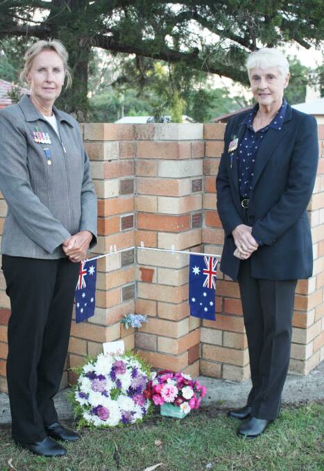 Daughters of Curley Wamsley: Julie Wamsley of Wingham and sister Kerry Marriott of Sydney beside their dad and mothers memorial at Wingham Presbyterian Church Columbarium Wall. Photo: Pam Muxlow