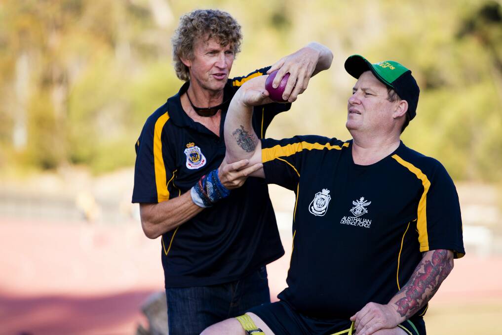 In training: Darren Robinson getting shot put pointers by Australian athletics coach Chris Nunn during the 2017 training squad camp. Photo: courtesy of Department of Defence.