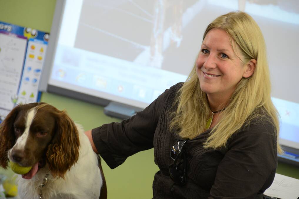 Narelle Campbell with her dog Gus at Coopernook Public School in 2013. File photo