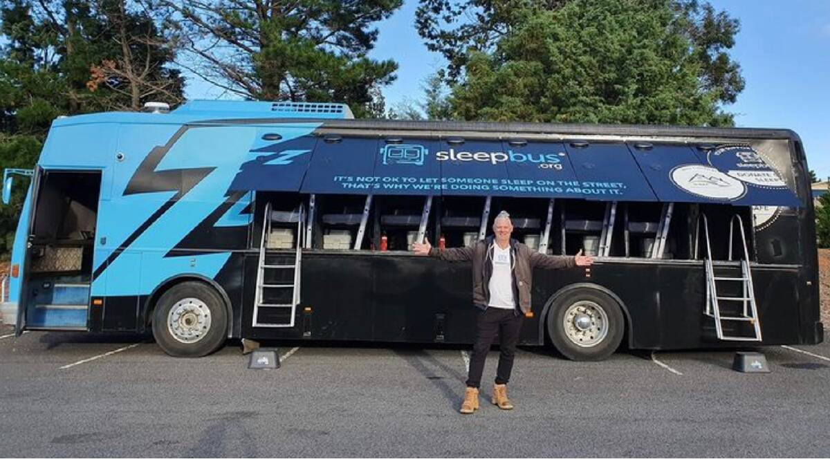 Sleep Bus founder, Simon Lowe with one of the two Sleep Buses that are operating out of Queanbeyan, showing the individual sleeping pods. Photo supplied
