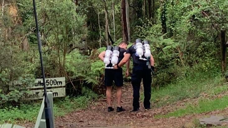 The operation involved lugging oxygen tanks to the bottom of the falls. Picture courtesy Taree Rescue Squad