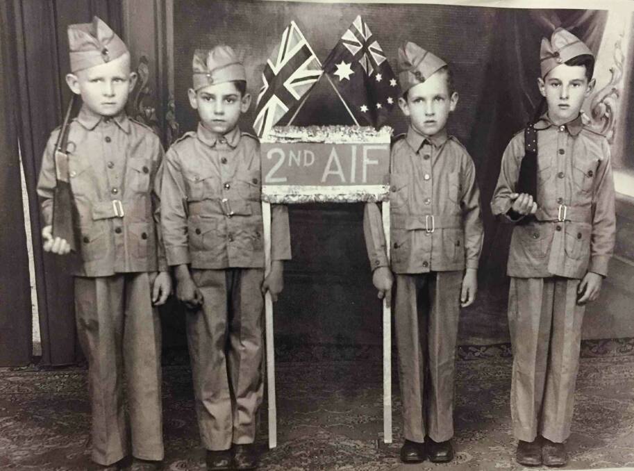 Rex Solomon (left of the flag) was one of the school children who used to spot planes on top of Foggs during WWII.