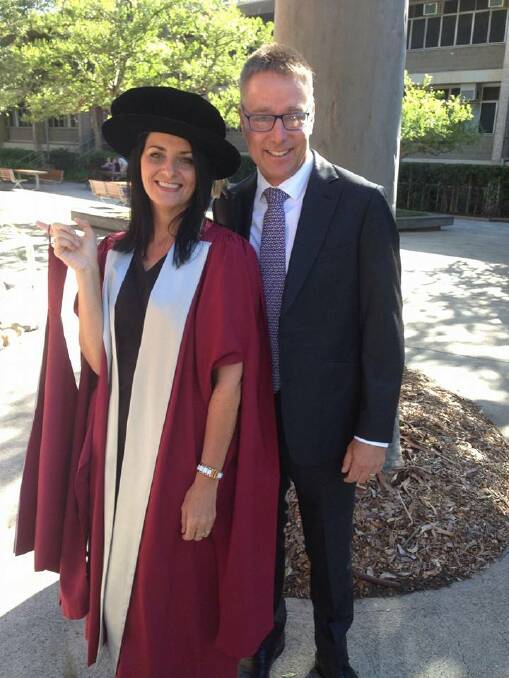 The doctors Rayson: Di at her graduation ceremony at the University of Newcastle, with her husband Phil. Photo: supplied