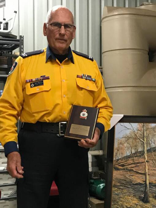 Rare honour: Bert Bennett of Tinonee brigade was been awarded Life Membership of the NSW Rural Fire Service. Photo: supplied