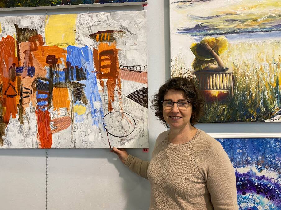 Ready and waiting: Taree Artists Inc. member Christine Long at the Taree Open Art Exhibition. Photo: Scott Calvin