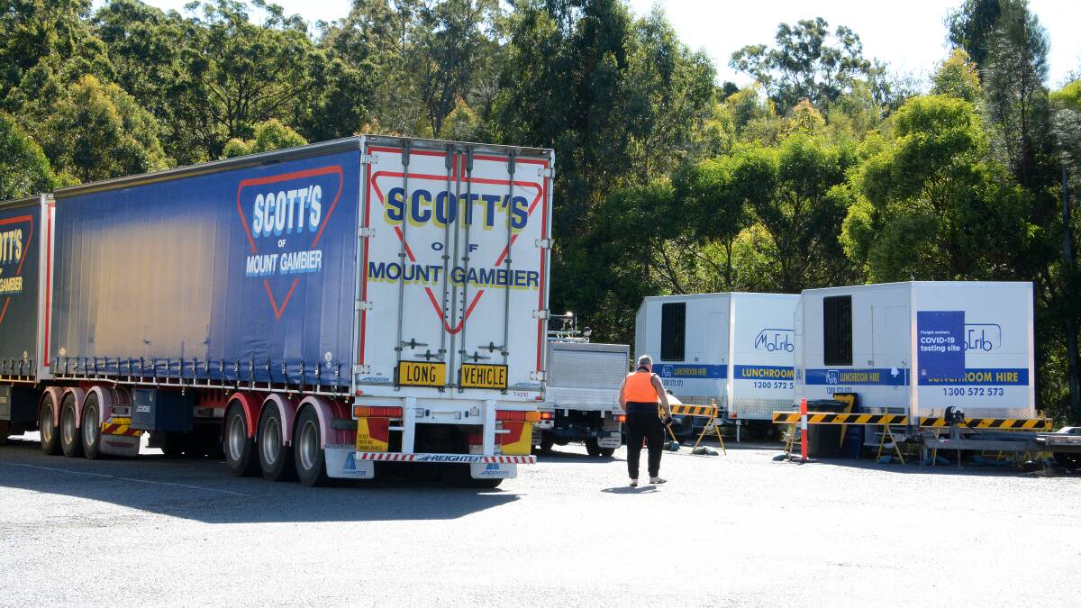 The two vans at Taree South Service Centre where truck drivers get tested for COVID. Photo Scott Calvin