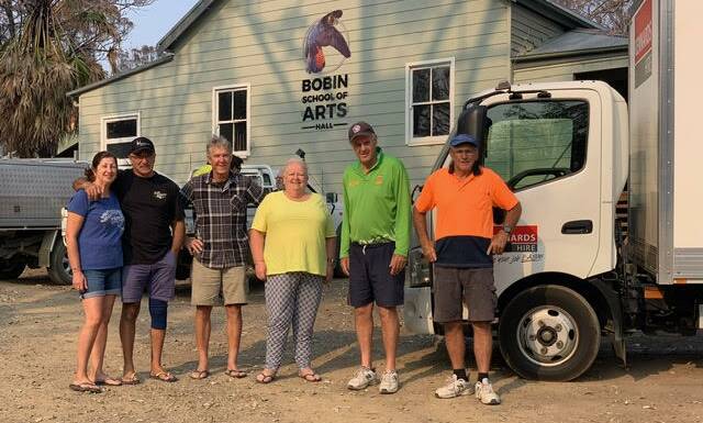 Luisa and Paul Calleja from Shell Cove, Rick (from Bobin), Cathy and Dene Herbert, and Dick Plummer (Shell Cove) with their deliver. Photo supplied