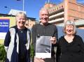 Manning Great Lakes Community Health Action Group members Carmel Bartlett, Eddie Wood and Trish Wood, with a copy of the Lower Mid North Coast Clinical Services Plan. Photo: Scott Calvin