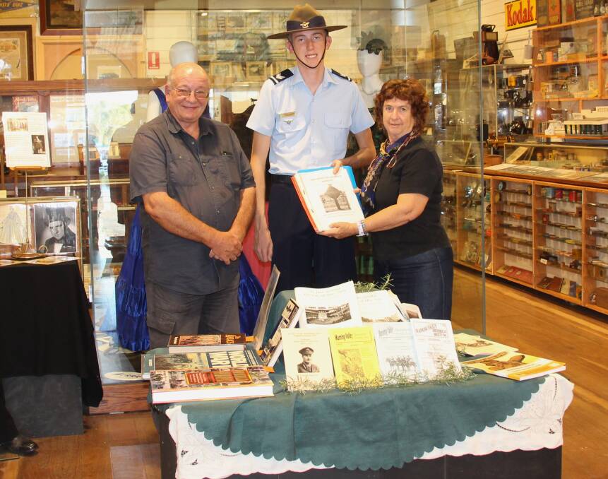 Cadet Sergeant Galen Wiseman at Wingham Museum with curator Terry Tournoff and volunteer Margaret Clark. Photo: supplied