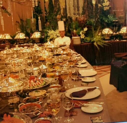 Mike surrounded by gold dishes in the wealth of Saudi Arabia. Photo supplied