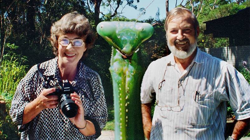 The Mantis Wildlife Films team: Densey and Jim, with an example of what the lens Jim invented made possible - great depth of field where a close up subject (in this case a praying mantis) and subjects further away could both be shot with clarity. Photo supplied by Jim Frazier
