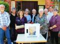 Wally Riley from Taree Masonic Lodge 44 handing over the donated defibrillator to Tinonee Memorial School of Arts Hall. Picture Pam Muxlow.
