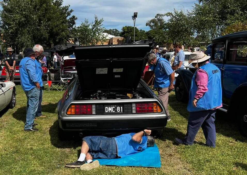 The judges go to work judging the DeLorean. Photo supplied