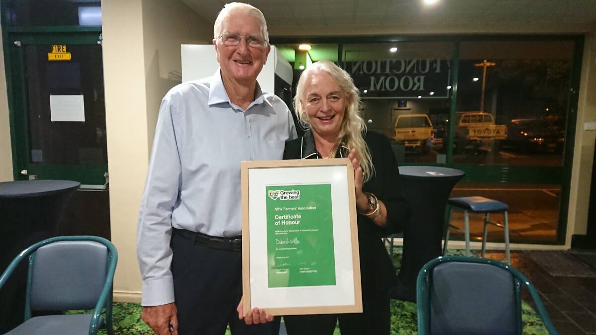 Marlee farmer Neville Campbell with award recipient Deborah Willis from Lansdowne, at the meeting at Wingham Services Club. Photo: supplied
