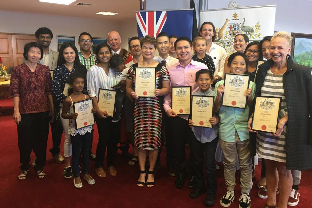 No board shorts or thongs in sight: Proud new Australian citizens at the April 2018 Citizenship Ceremony in Council Chambers at Taree. Photo: Julia Driscoll
