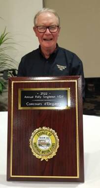 Gary Cox with the plaque he gets to keep. The actual trophy is a perpetual trophy. Photo supplied