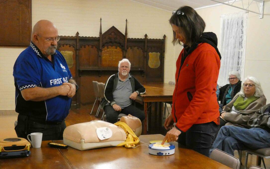 John Maclean from FAIM giving a demonstration on how to use the defibrillator at Coopernook. Photo supplied