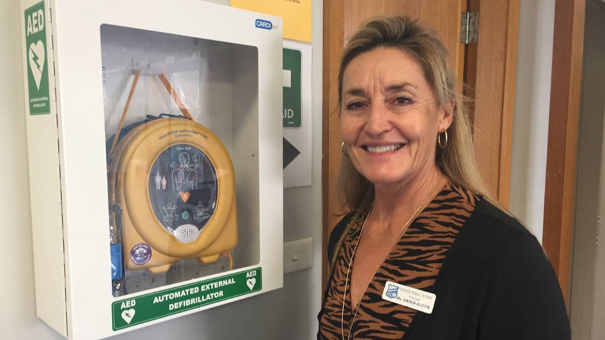 Tinonee Public School principal Karen Austin with the school's defibrillator. Photo: Julia Driscoll
