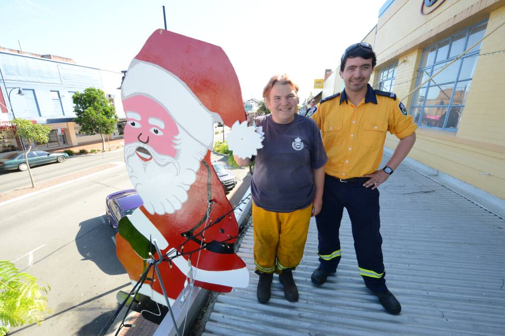 RFS volunteers used to put Santa Claus cutouts on the roofs in the CBD of Taree. Photo: Scott Calvin