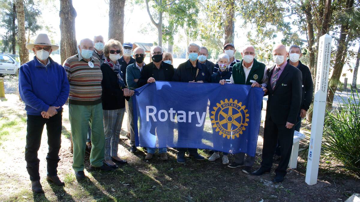 Members of Rotary Club of Taree with MidCoast Council mayor David West at the unveiling of the Peace Pole at Rotary Park in Taree. Photo: Scott Calvin