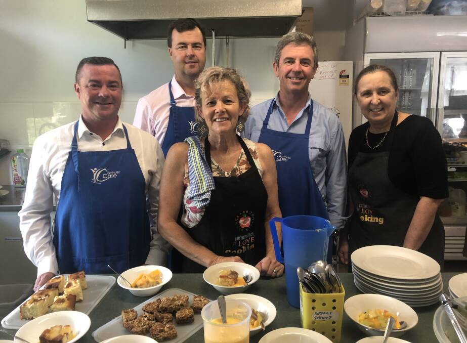 Helping hands: Gary Christensen, CatholicCare; Sean Scanlon, CEO of the Diocese of Maitland-Newcastle; Member for Lyne Dr David Gillespie and volunteers Leanne Foster and Karen Larkin. Photo: supplied