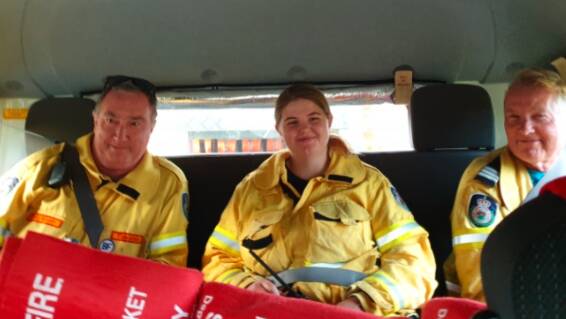 Tara with members of the Tinonee Rural Fire Brigade attending her first call out. Photo supplied