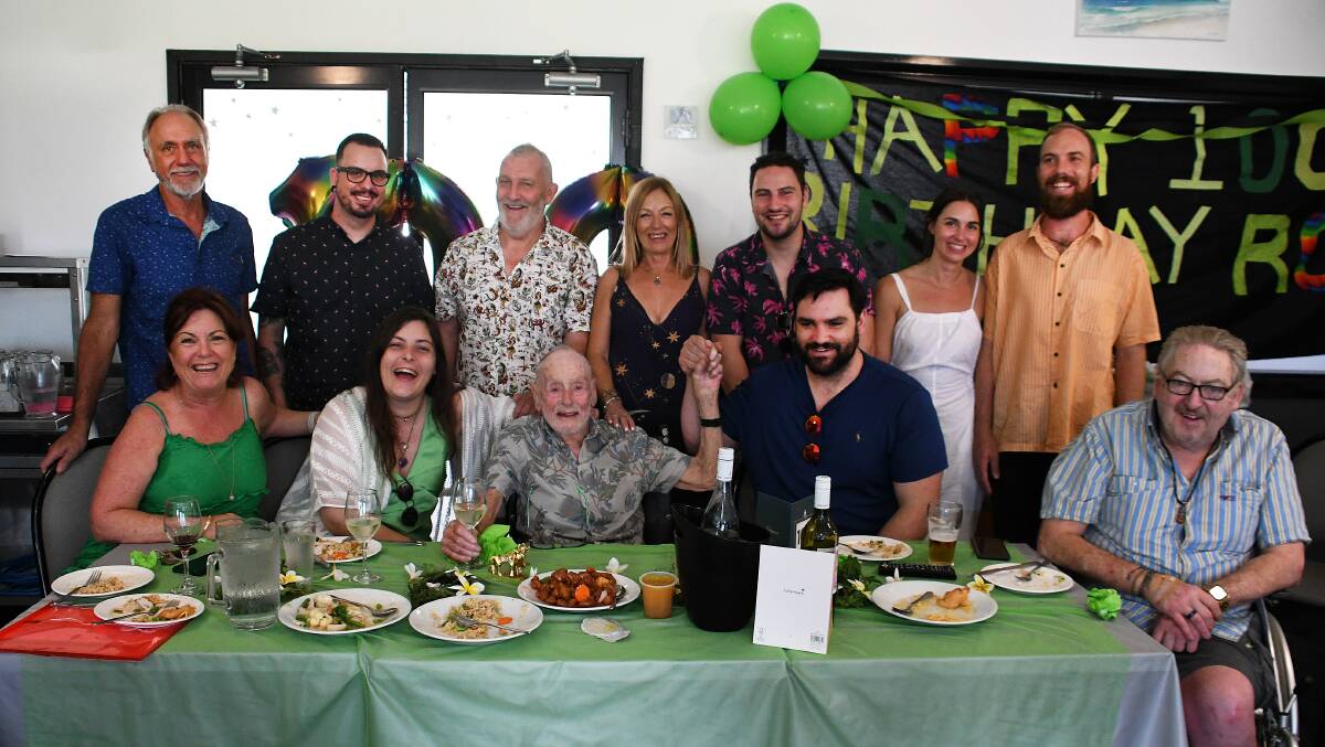 Ron Wood (seated centre) celebrating his 100th birthday with family and friends. Picture Scott Calvin