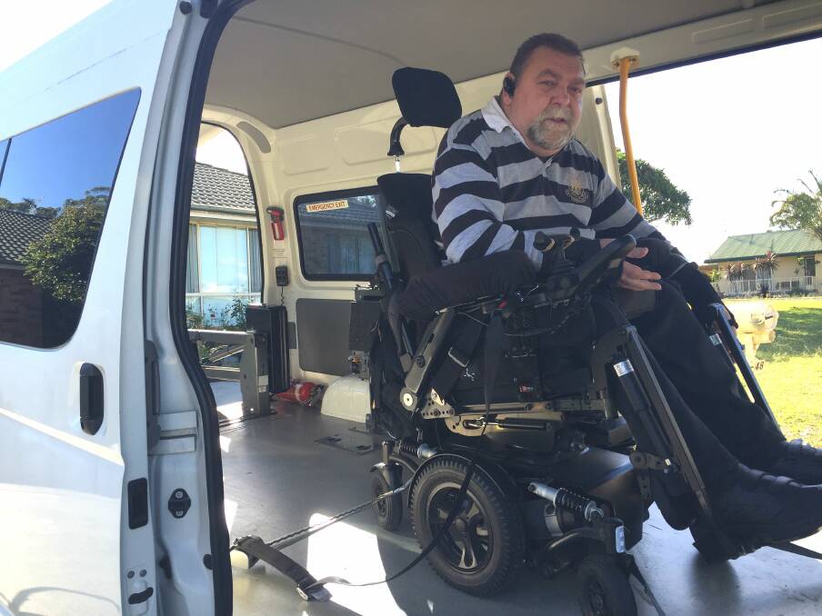 Ready for a drive: John's wheelchair is firmly strapped to four points of his special-purpose van.
