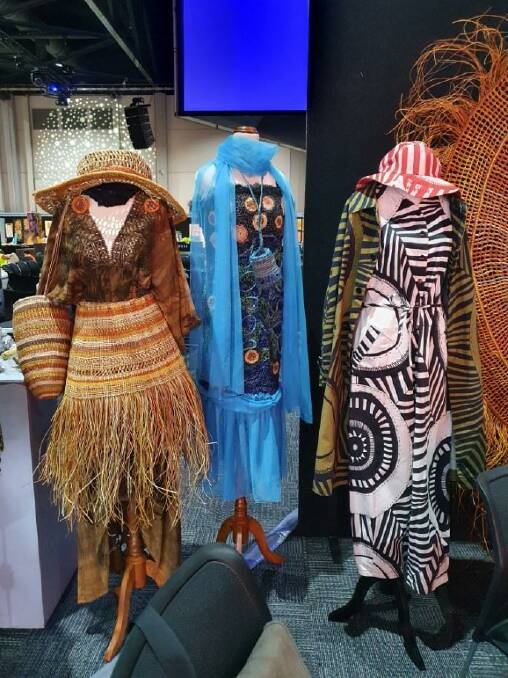 Aunty Pam Saunder's piece (centre) was one of three selected works for the Country to Couture stand at the Darwin Aboriginal Art Fair. Picture supplied