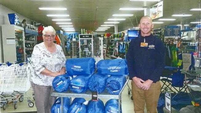 Generous partnership: Helen Russell from the Chatham Uniting Church and BCF employee Kyle. Photo: supplied.