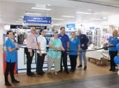 Pam Muxlow assists with the official name change of Advantage Pharmacy in Wingham. Picture supplied.