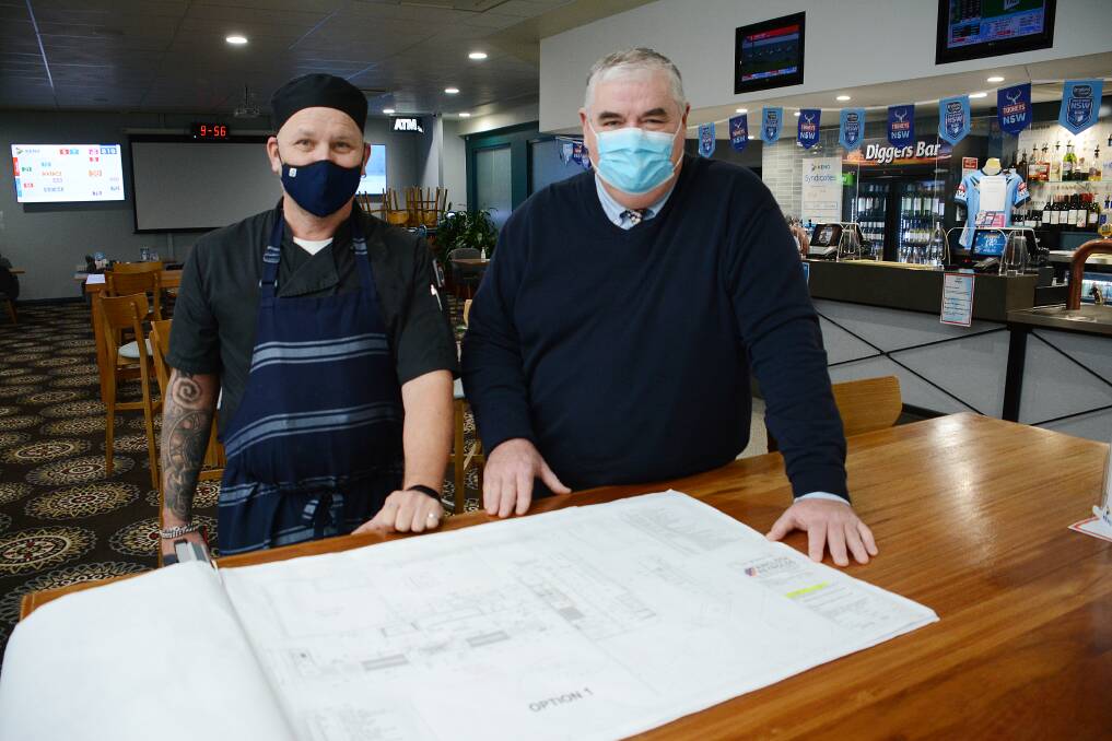 Wingham Memorial Services Club chef Greg Riding and secretary manager Dean McCarthy look over the plans for the upgrades. Photo: Scott Calvin