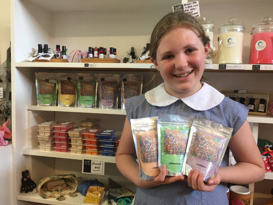 Salty Bliss: Caitlin shows off her range of bath salts that are stocked on the shelves at Not a Café. Photo: Julia Driscoll