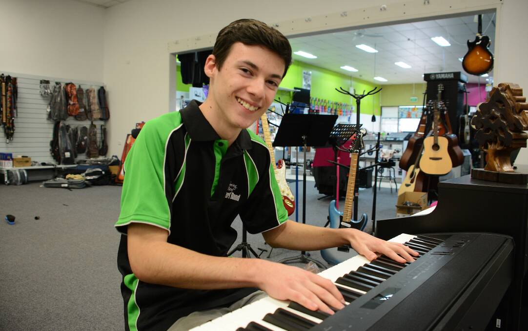 Riley Brown at his parents' music store, Bass N Blues in Taree. Photo: Scott Calvin