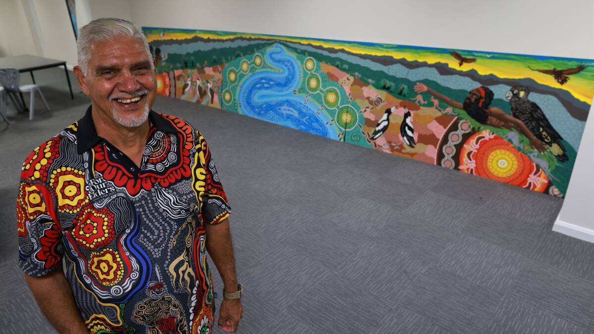 Uncle Russell Saunders OAM with the mural he and Raechel Saunders created. Picture by Scott Calvin.