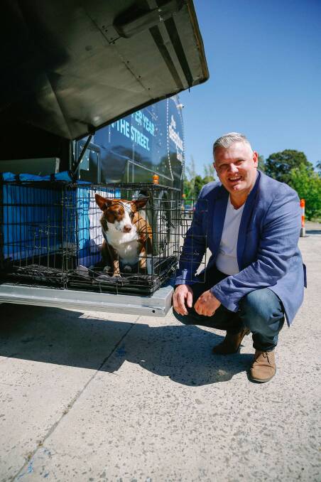 Sleepbus creator, Simon Lowe, and Tilly in one of the animal compartments. Photo supplied