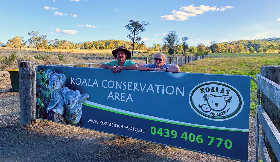 Paul and Christeen McLeod at the entrance to Koala in Care's newly purchased property, made possible by donations after the Black Summer bushfires.. Photo: Julia Driscoll
