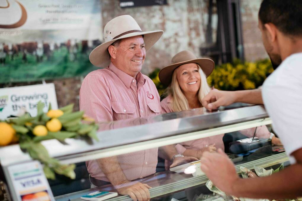 Greg and Lauren Newell of Linga Longa Farm at their stall at Carriageworks Farmers Markets in Sydney. Photo: supplied