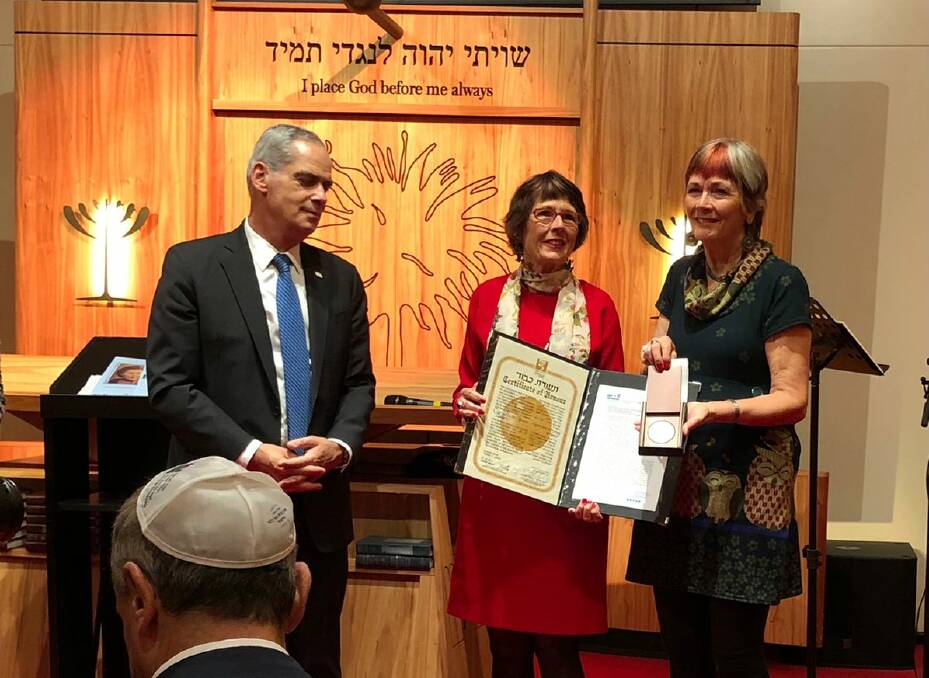 Anke de Reuver (right) and sister Frouke, from Israel's interim Ambassador to Australia, Jonathan Peled. Photo supplied