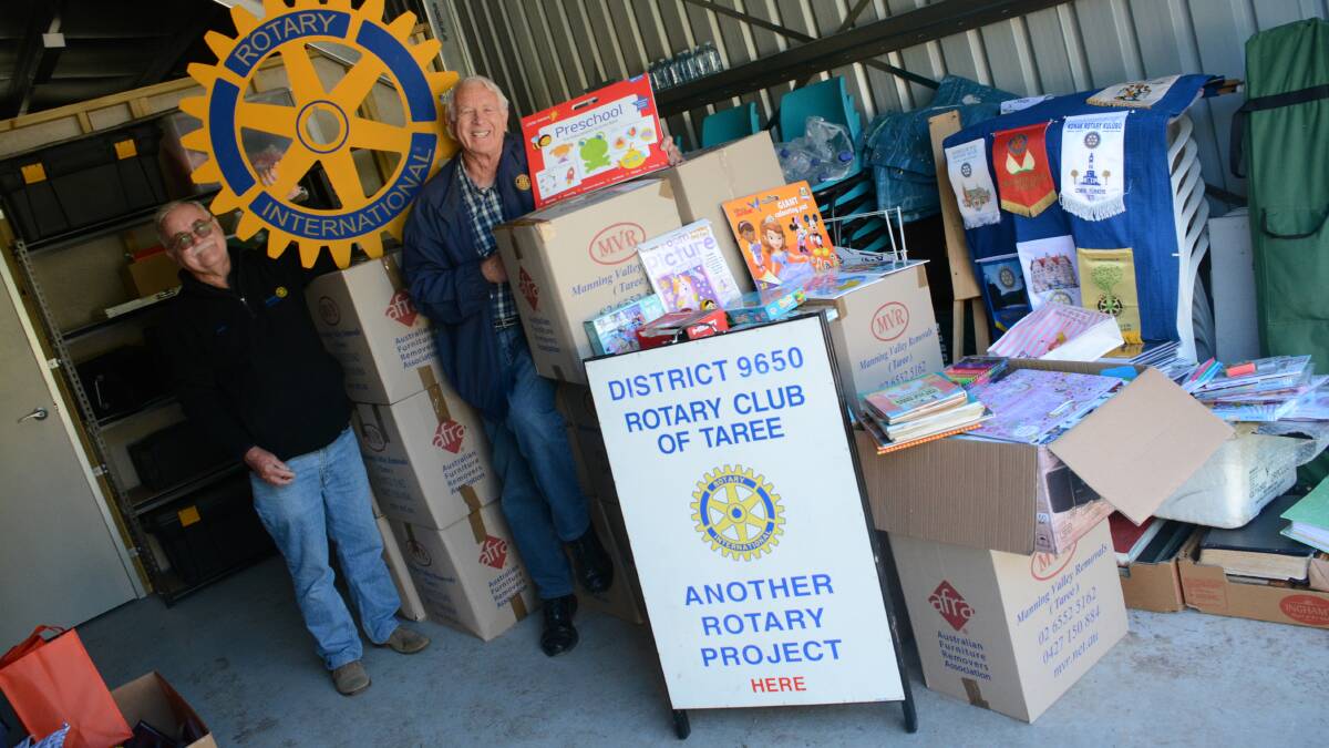 Special delivery: Rotary Club of Taree president David Denning, and member Ian Dyball getting together the boxes to send to the Northern Territory. Photo: Scott Calvin