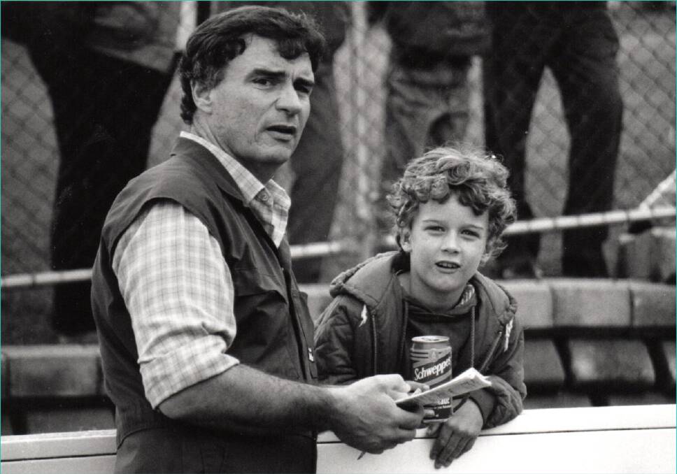 John on duty at the races in 1994, with his son, Liam. Photo: Brock Perks
