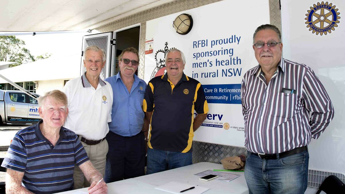 Men at MHERV: Robert Wooley (seated) signs up for a health check. Piictured with Rotarian Max Carey, registered nurse Robert Woolley, Rotarians Murray Difford and Laurie Easter. Photo: Ashley Cleaver