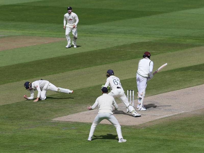 Ollie Pope catches West Indies' Alzarri Joseph on day four of the second Test at Old Trafford.