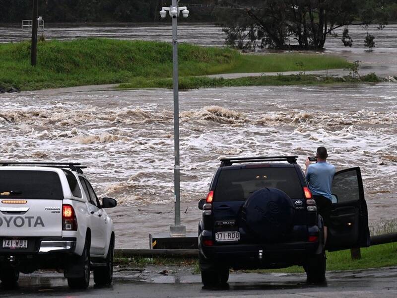 The Coomera River is among the waterways subject to a flood warning as rain lashes Queensland. (Dave Hunt/AAP PHOTOS)