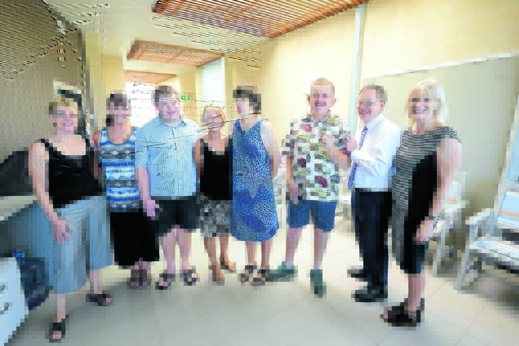 Celebrating the official opening of the Dundaloo Support Services Old Bar villas is manager Jane Holland, support worker Sue Owens, Gavin Andersen, co-ordinator Monica Hindmarsh, Sarah Corbett, John Cameron, and John Ryan and Linda Hume from NSW Family and Community Services.