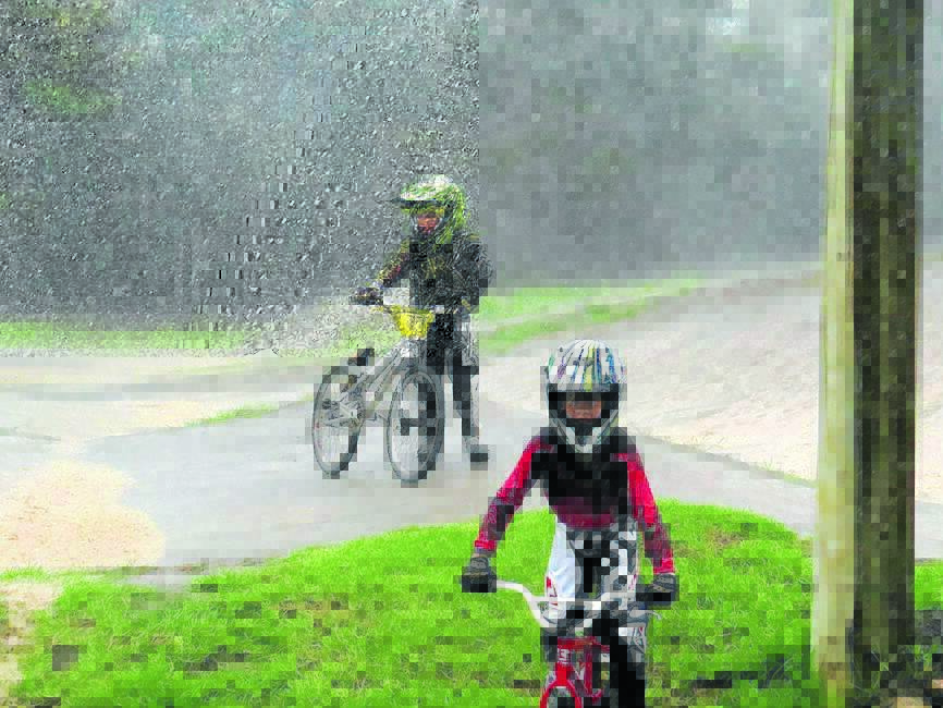 Riding in the rain: Remy Mier-Smith and Jimmy Michaelides.