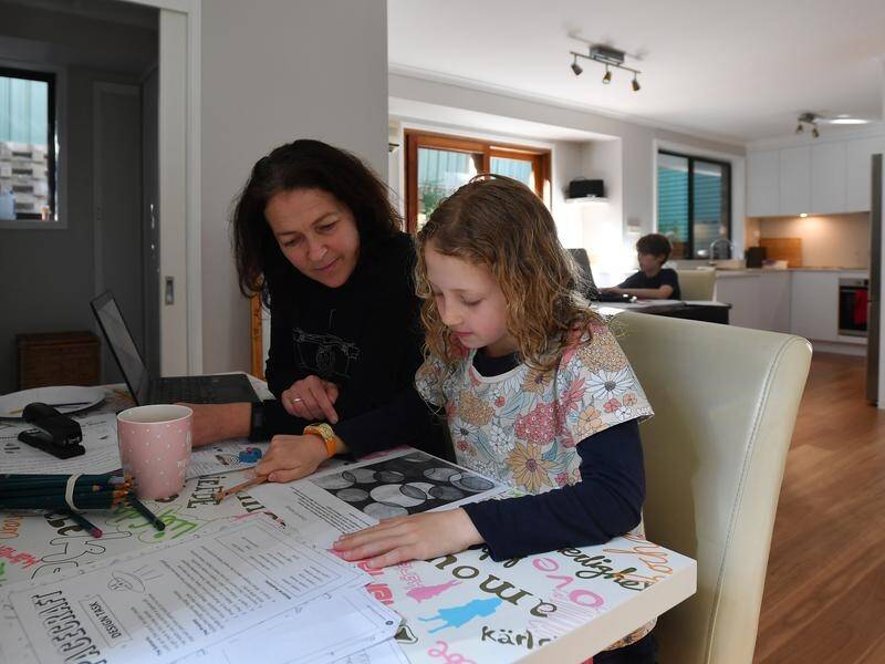 Working mum Georgina Coase races upstairs to her own desk as soon as morning lessons are over.