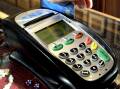 Up to 80 per cent of welfare payments are allowed to be placed on the cashless debit cards. (Alan Porritt/AAP PHOTOS)