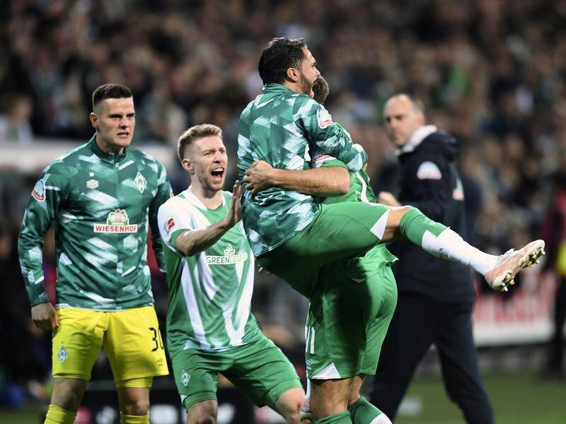 Werder Bremen celebrate Niclas Fullkrug's late goal that gave them a 1-0 Bundesliga win over Hertha. (AP PHOTO)